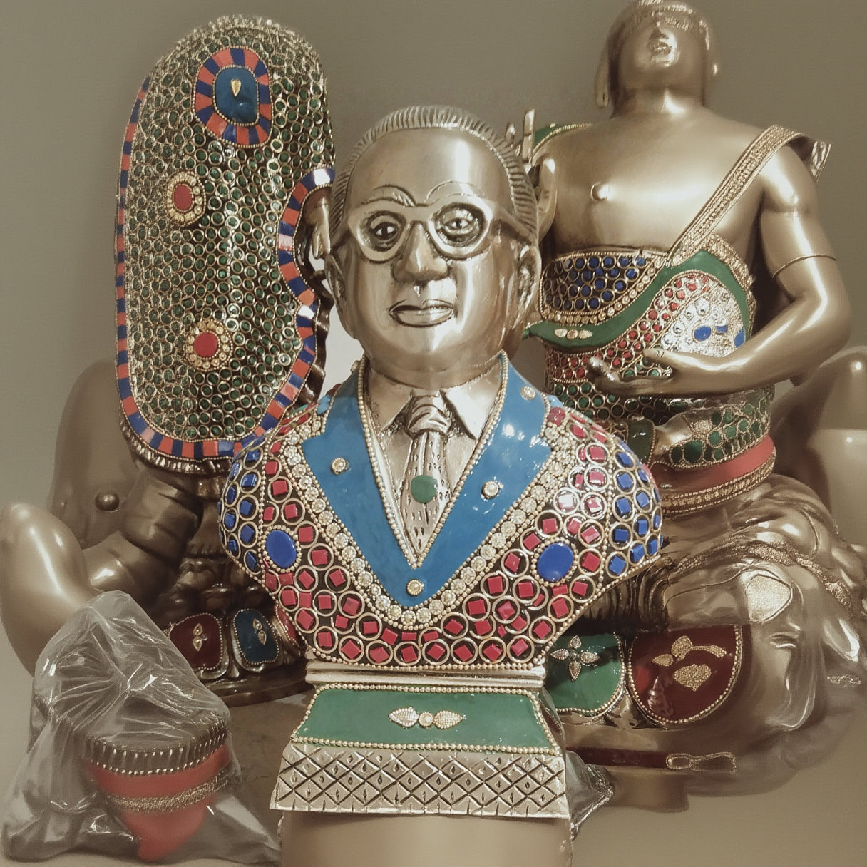 Decorative object with a face design and colorful embellishments