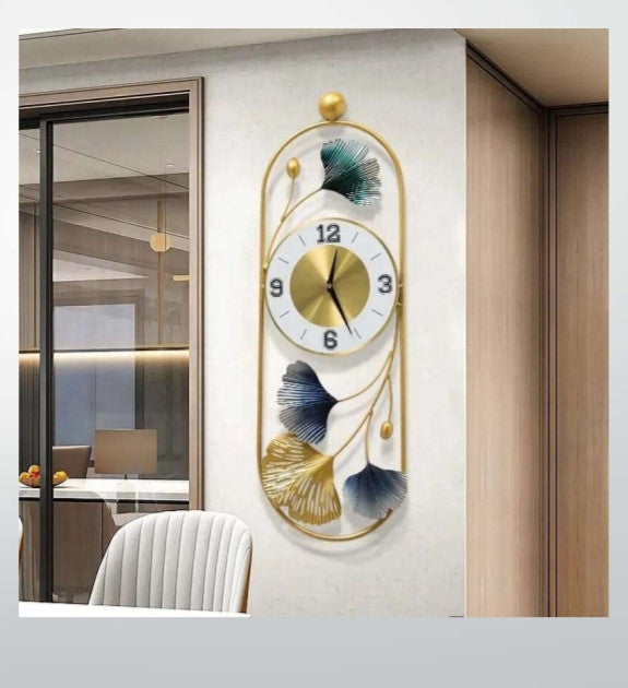 Decorative wall clock with floral design on a white wall.