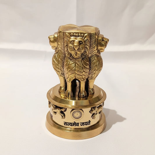 Brass lion statue on a white background