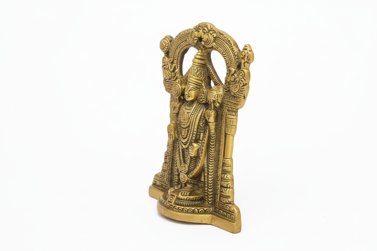 Gold-colored statue of a deity on a white background