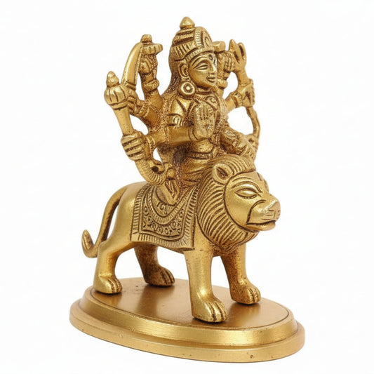 Gold-colored statue of a deity on a white background