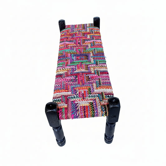 Multicolored woven bench with black legs on white background