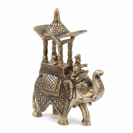 Decorative silver elephant figurine with intricate designs on a plain background
