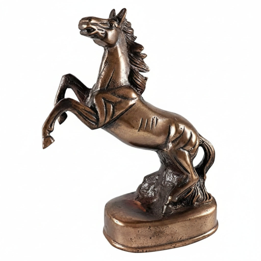 Bronze statue of a rearing horse on a white background