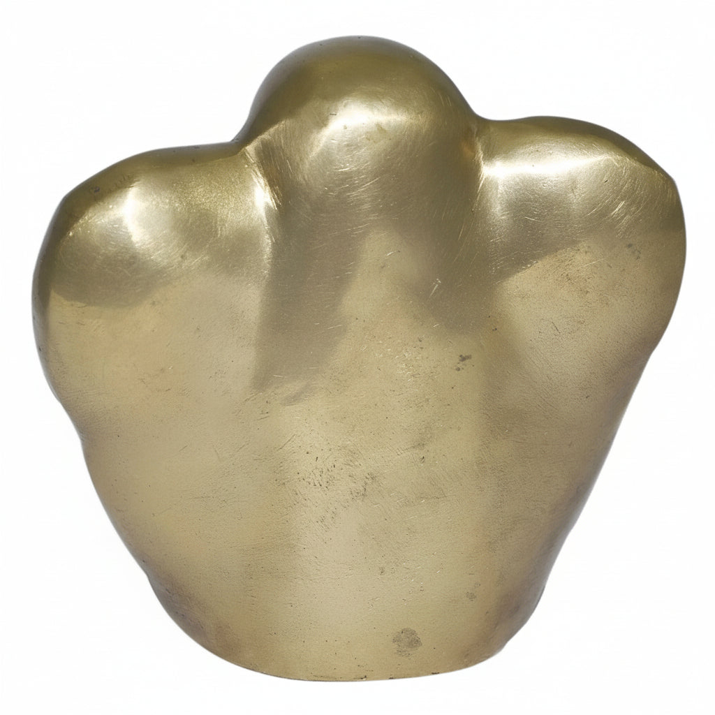 Gold-colored abstract sculpture on a white background