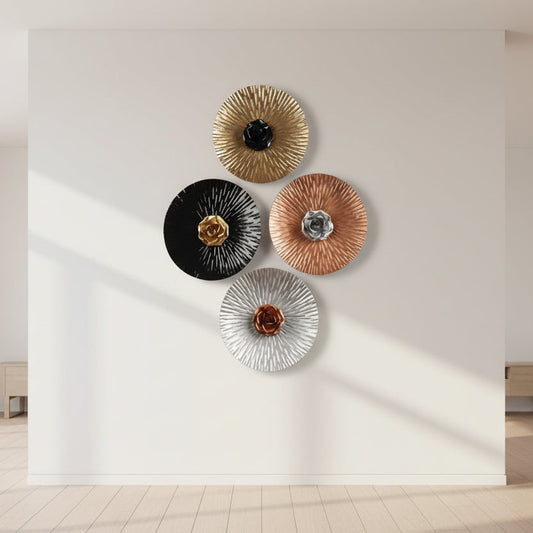 Decorative wall art pieces with floral elements on a light background