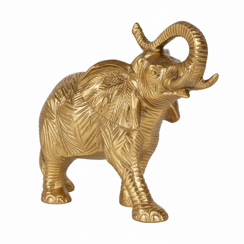 Gold elephant figurine on a white background