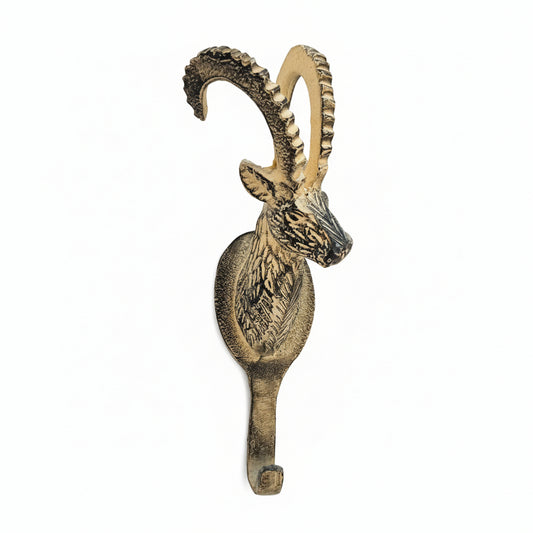 Decorative wall hook with a stylized animal head design on a light background