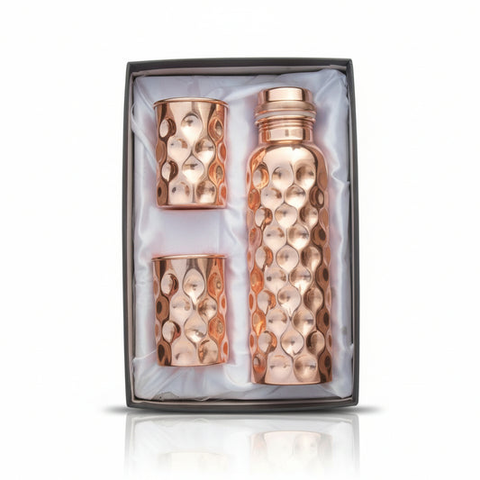 Rose gold water bottle and tumbler set in a box
