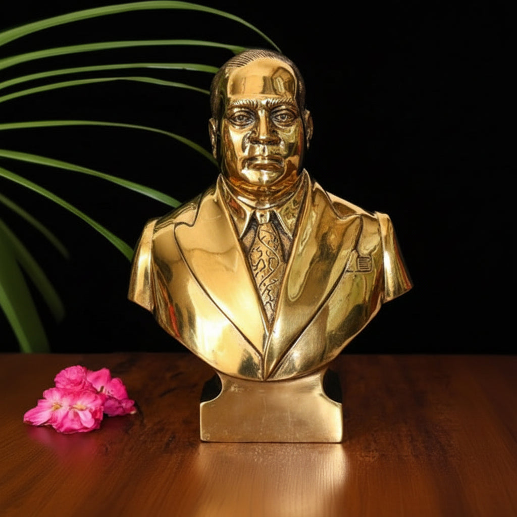 Silver bust of a man on a wooden surface with a dark background