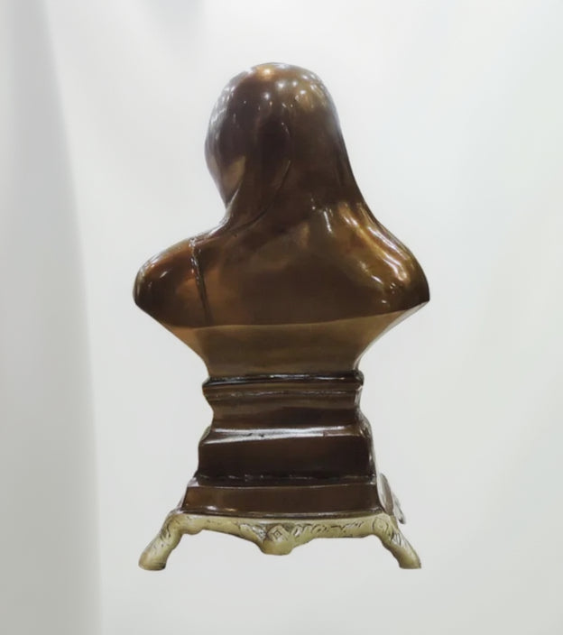Bronze bust of a woman on a white background