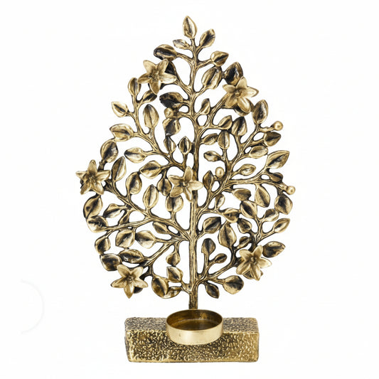Decorative gold tree-shaped candle holder on a white background