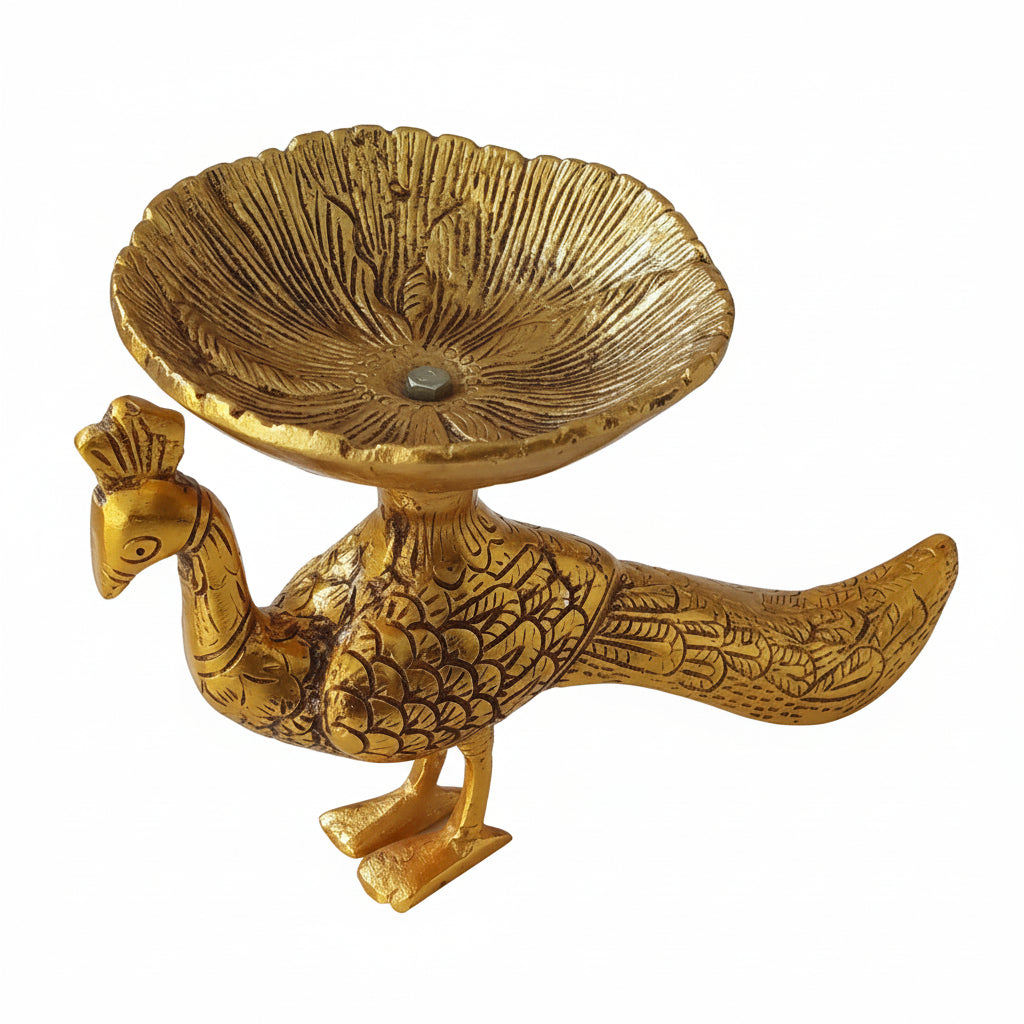 Gold-colored peacock-shaped decorative item on a white background