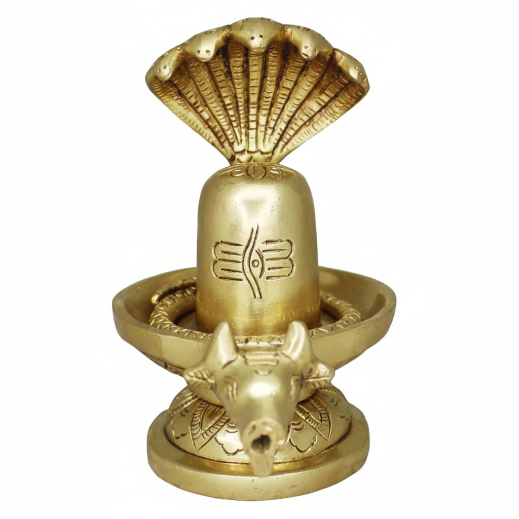 Brass lamp with shell design on a white background
