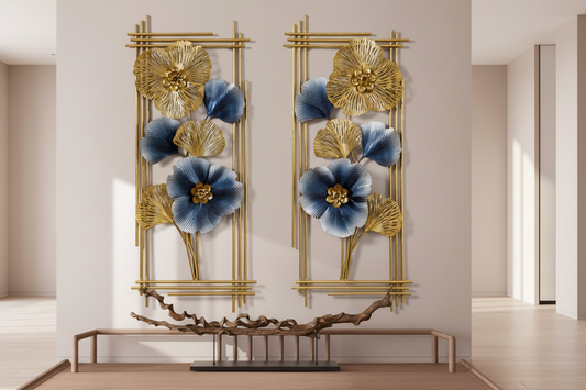 Decorative wall art with blue flowers and gold frames on a light gray wall.