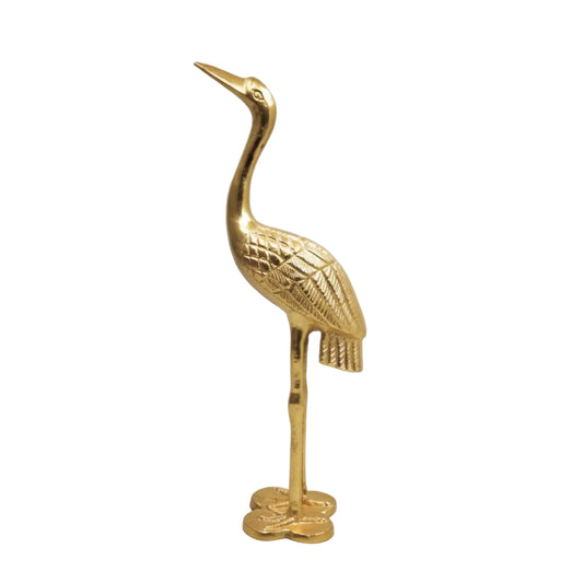 Gold bird-shaped object on a white background