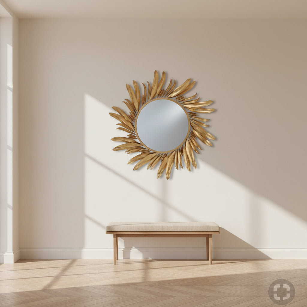 Gold sunburst mirror on a white background
