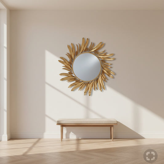 Gold sunburst mirror on a white background