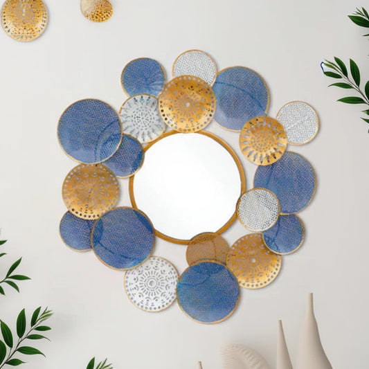 Decorative wall mirror with blue, gold, and white circular plates on a white background