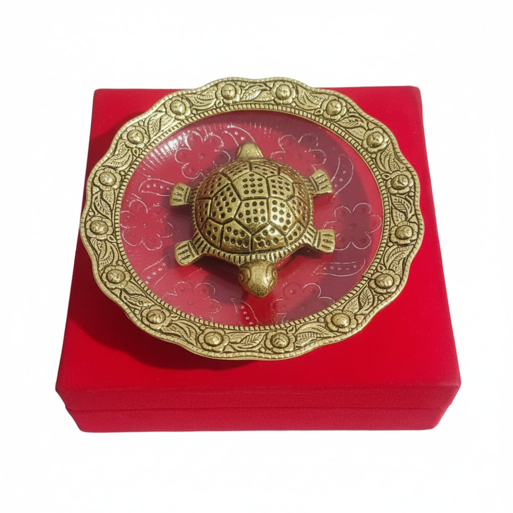 Decorative turtle figure on a red base with intricate patterns