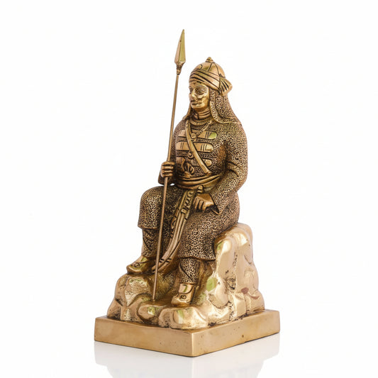 Bronze statue of a warrior holding a spear on a white background