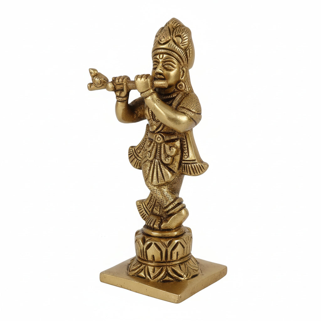 Bronze statue of a figure playing a flute on a white background