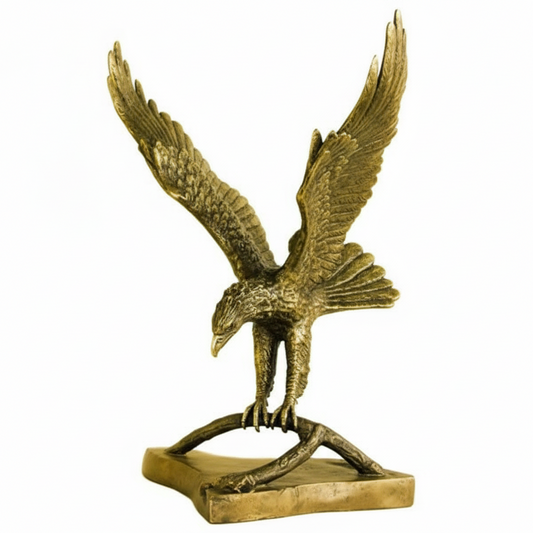 Bronze statue of an eagle with outstretched wings on a white background