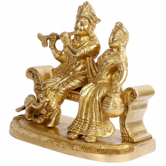 Gold statue of a couple on a white background