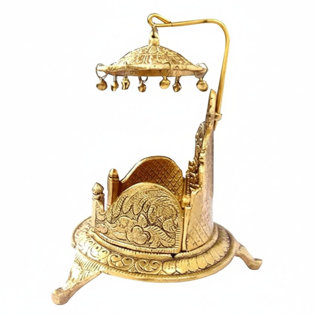 Decorative gold metal incense holder with intricate designs on a white background