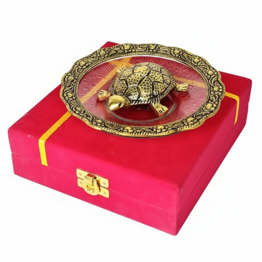 Decorative turtle on a red box with gold accents