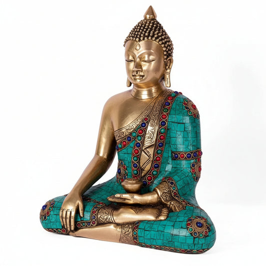 Decorative statue of a seated figure in meditation pose with colorful attire on a white background