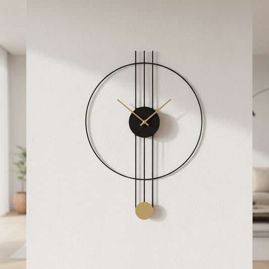 Modern wall clock with black and gold design on a concrete wall