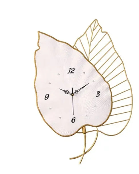 Decorative wall clock with leaf design on a white background