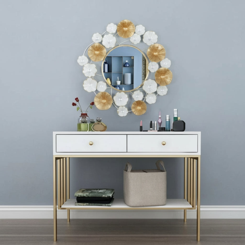 Decorative mirror with floral design above a white console table against a gray wall.
