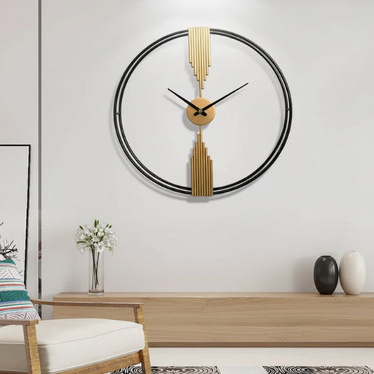Decorative wall clock with gold accents on a white wall