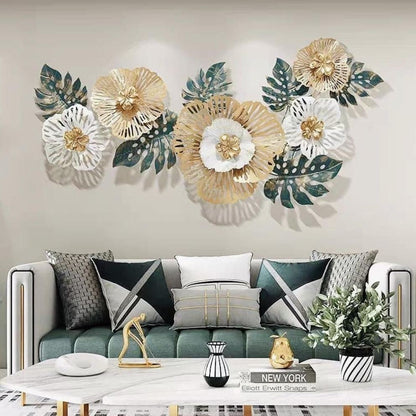 Decorative wall art with floral and leaf patterns above a living room sofa.