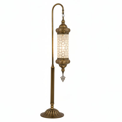 Decorative lamp with intricate design against a yellow background