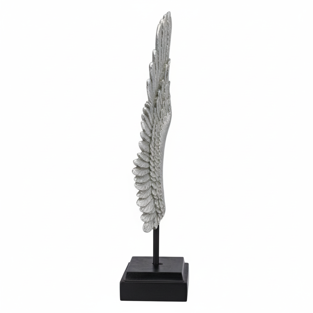 Decorative feather sculpture on a black base against a white background