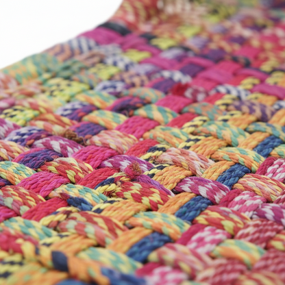 Close-up of a colorful braided rug with multicolor pattern