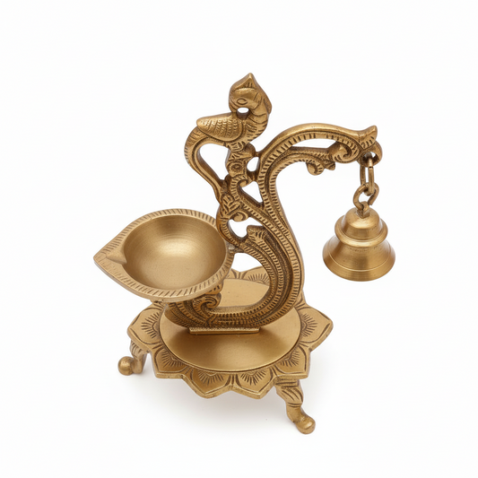 Decorative brass lamp with intricate design on a white background