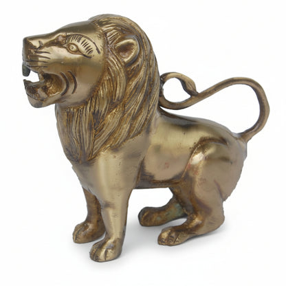 Brass lion statue on a white background