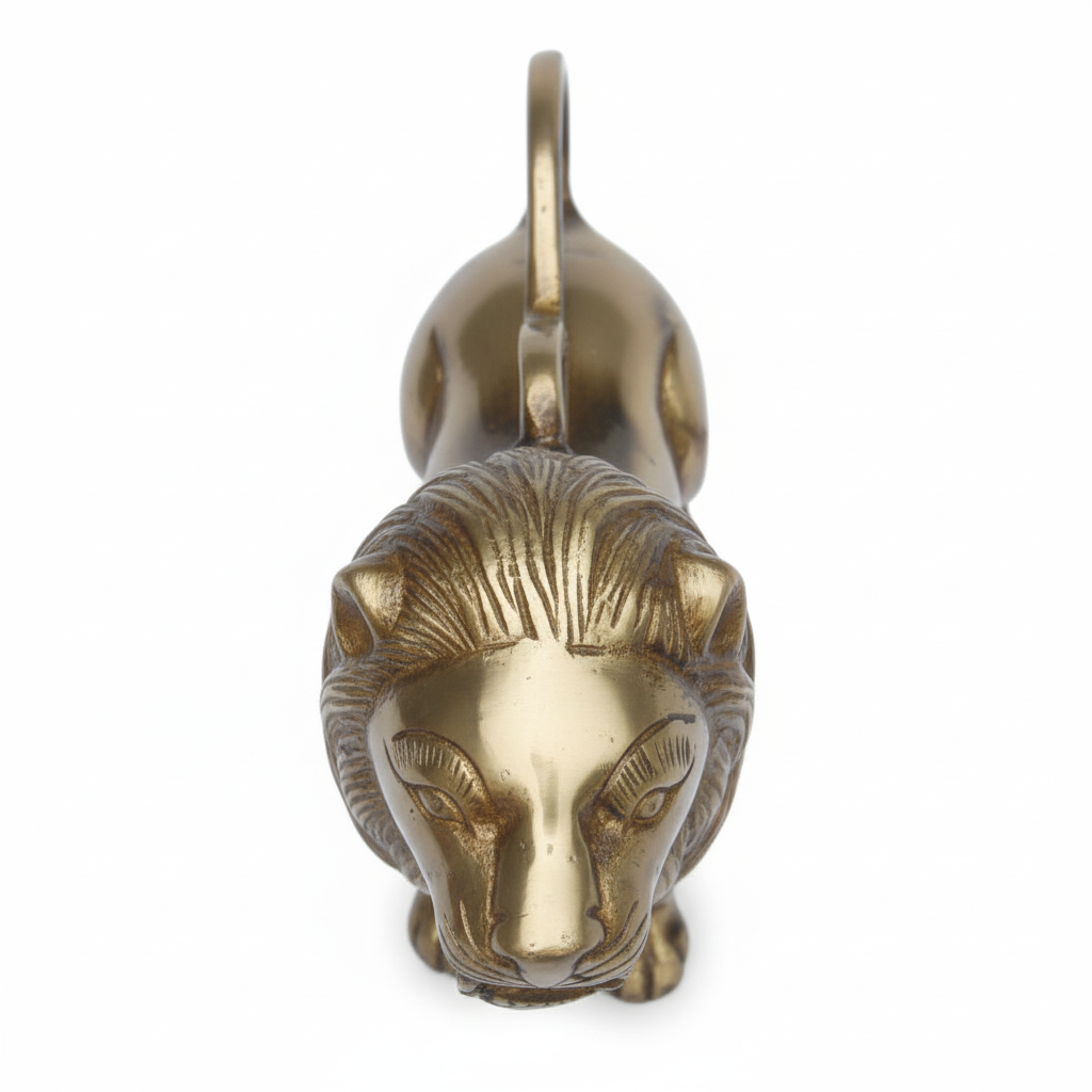 Brass lion head sculpture on a white background