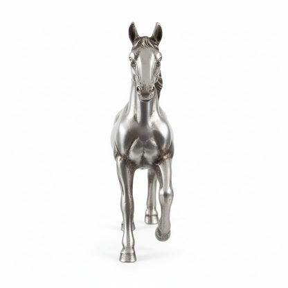Metallic horse figurine on a white background