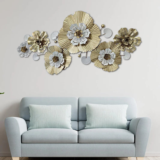 Decorative floral wall art above a light gray sofa in a room.