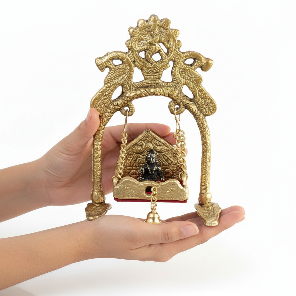 Decorative gold temple with a small statue held in a hand against a white background