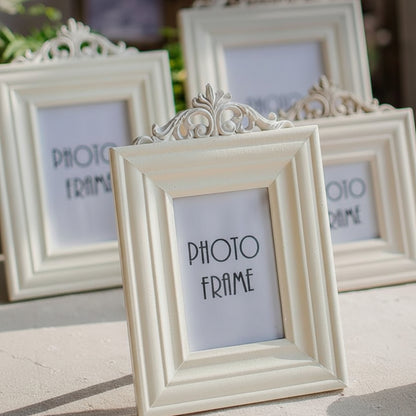 Decorative white photo frames with 'PHOTO FRAME' text on a blurred background