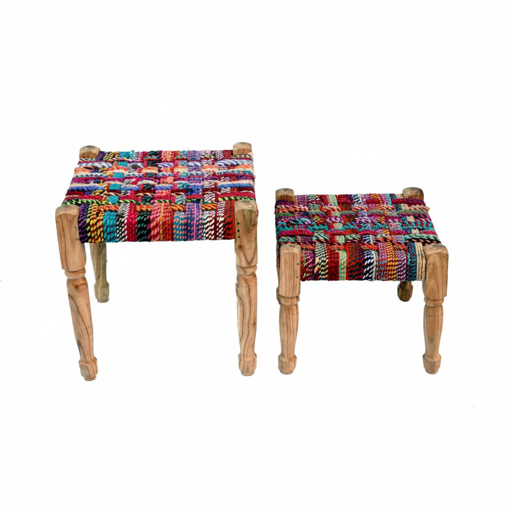 Two colorful woven stools on a white background