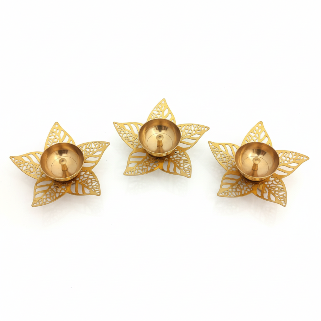 Three gold decorative candle holders on a white background