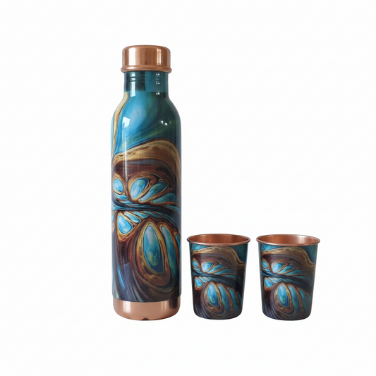 Decorative bottle and two cups with blue and brown abstract patterns on a white background