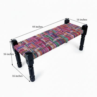 Multicolored fabric bench with black wooden legs and dimensions labeled on a white background